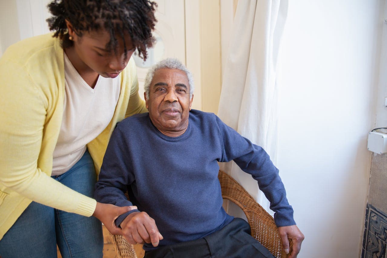 Nurse providing care to elderly patient